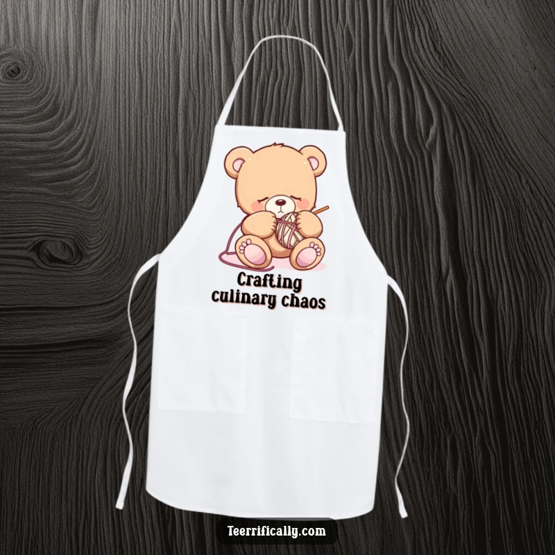 Funny sleepy teddy bear apron showing a drowsy bear attempting to knit, perfect for keeping clothes clean with a side of cute crafting humor.