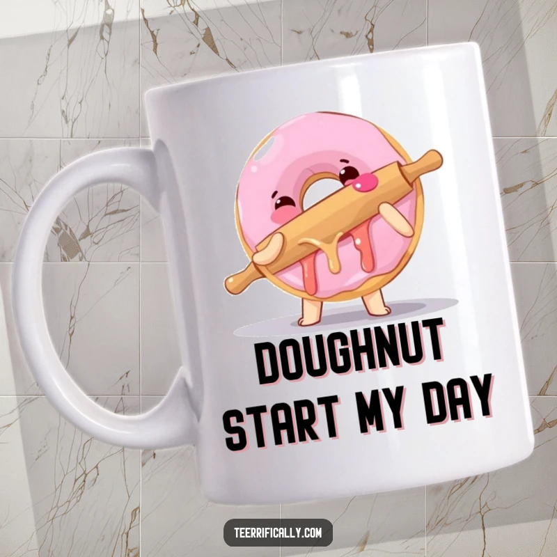 Funny mug shows a clumsy donut attempting to hug a rolling pin, expressing sticky, delightful chaos and baking humor.