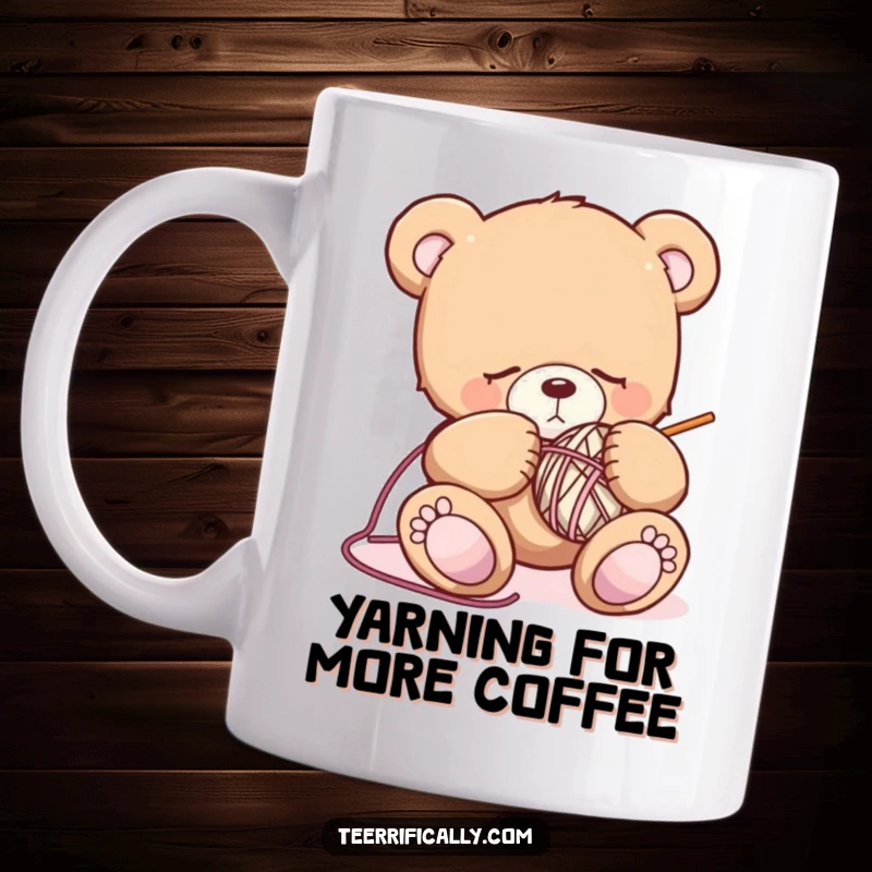 Funny sleepy teddy bear mug showing a drowsy bear fumbling with knitting needles and yarn, capturing a moment of cozy, humorous struggle.