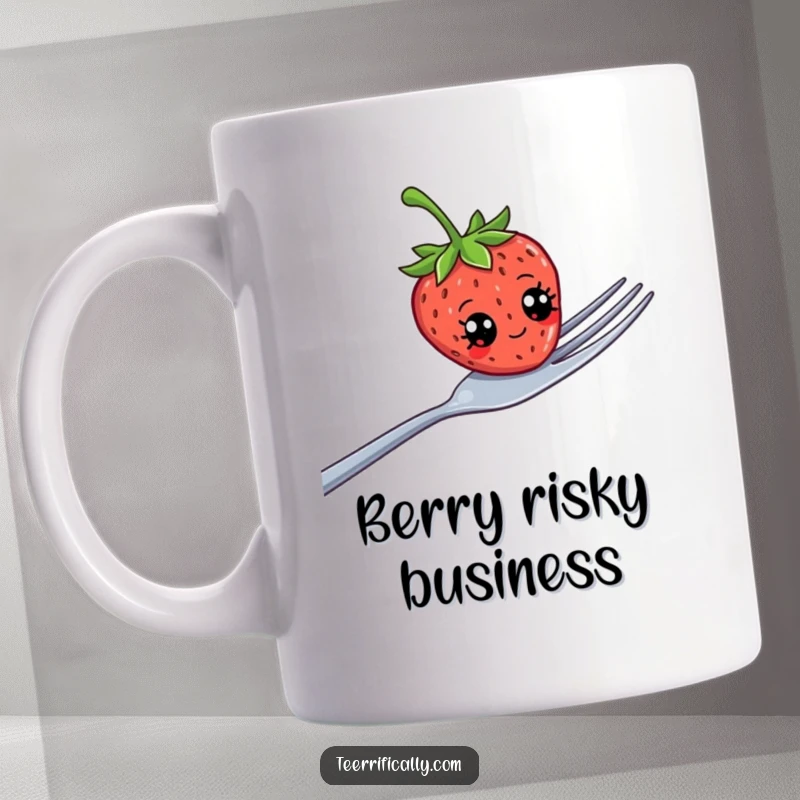 Funny strawberry with googly eyes precariously balancing on a giant fork, depicted on a ceramic mug, conveying playful chaos.
