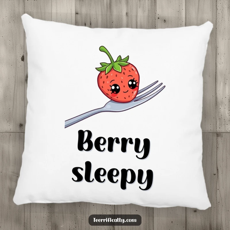 Funny strawberry with exaggerated googly eyes wobbling on a large fork, depicted on a soft decorative pillow.