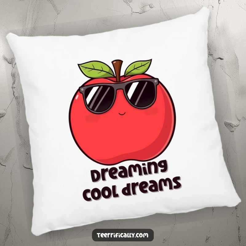 A plush, funny apple pillow showing a plump red apple in sunglasses winking slyly, offering comfort and cool humor.