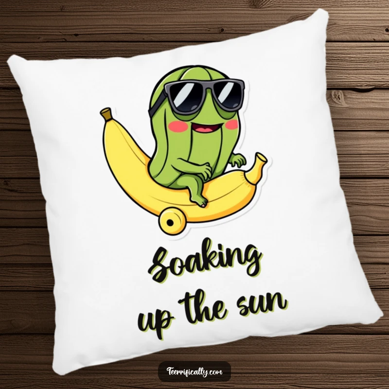 Funny pillow with a cool pickle in sunglasses riding a rolling banana, offering plush comfort and deliciously absurd humor.