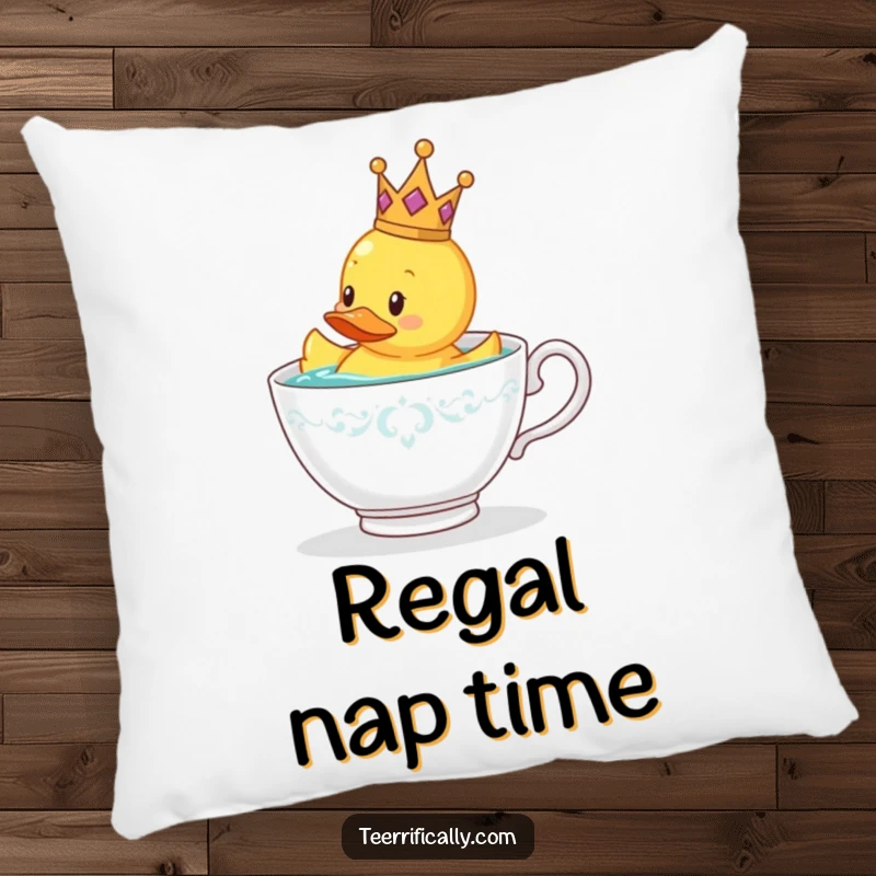 Funny rubber duck wearing a tiny crown floating in a teacup, soft pillow for a funny gift.