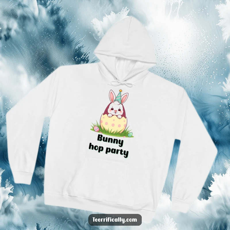 Funny hoodie showcasing a fluffy bunny in a party hat emerging from a large Easter egg, embodying festive fun and springtime excitement.