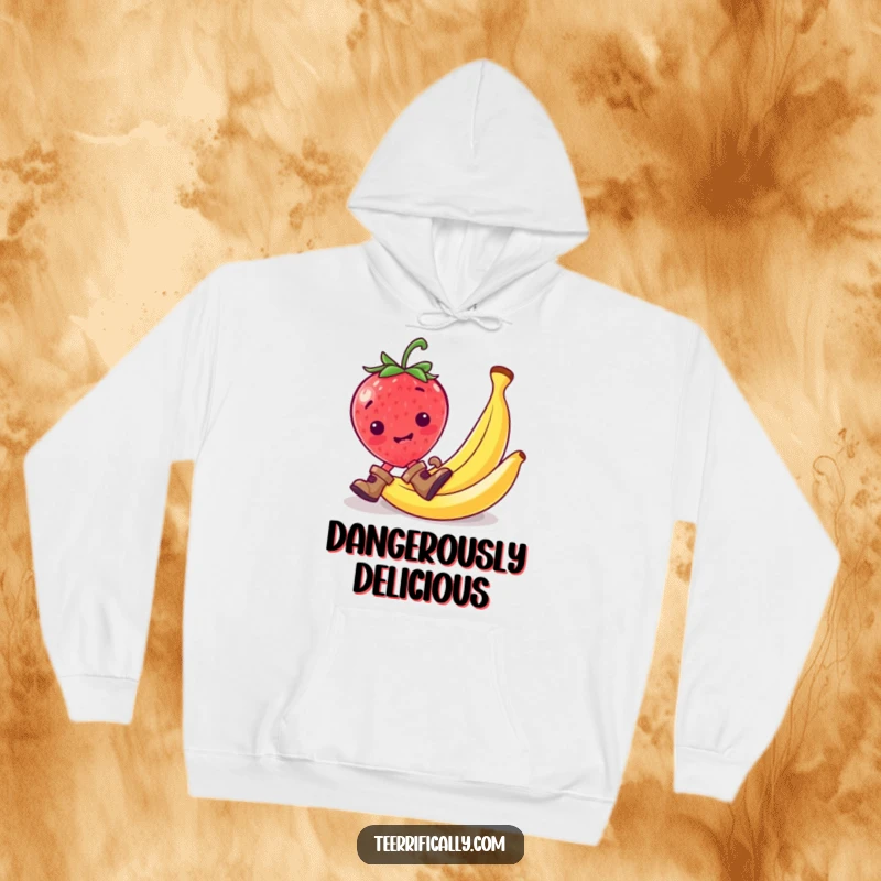 Funny strawberry in small boots slipping on a banana peel, featured on a cozy hoodie.