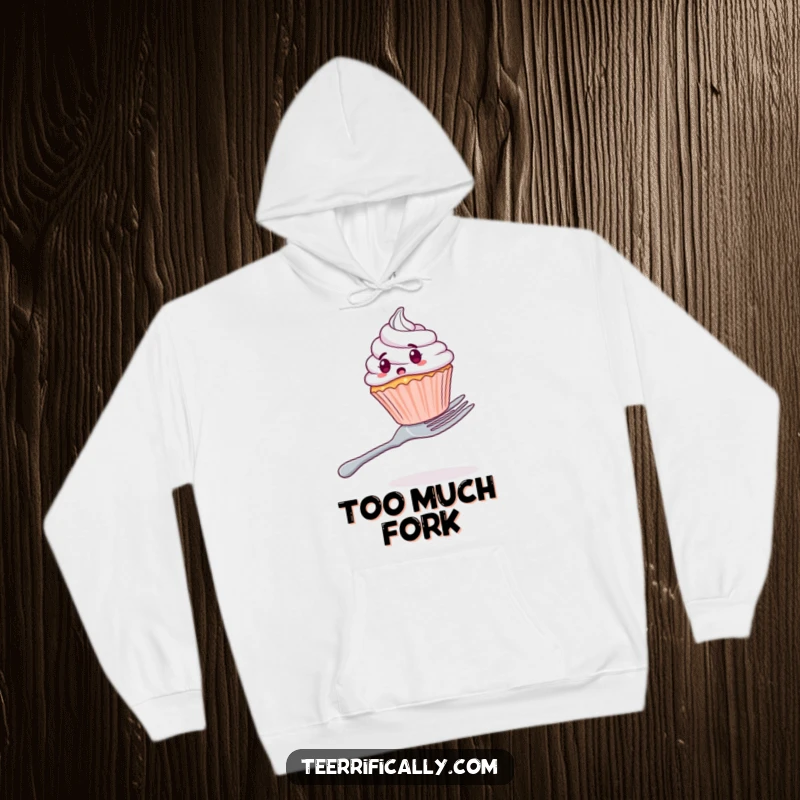Funny hoodie featuring a shocked cupcake trying to stay balanced on a colossal fork, a comical and cozy piece.