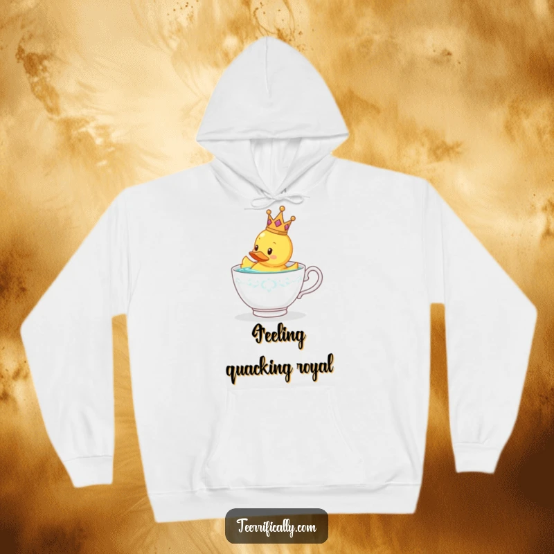 Funny rubber duck wearing a tiny crown in a hoodie, floating in a teacup, warm gift.