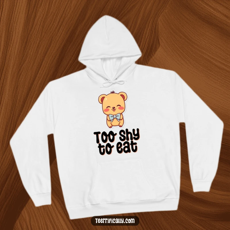 Funny hoodie with a shy hot dog character wearing a miniature bowtie and blushing, offering warmth and cuteness.