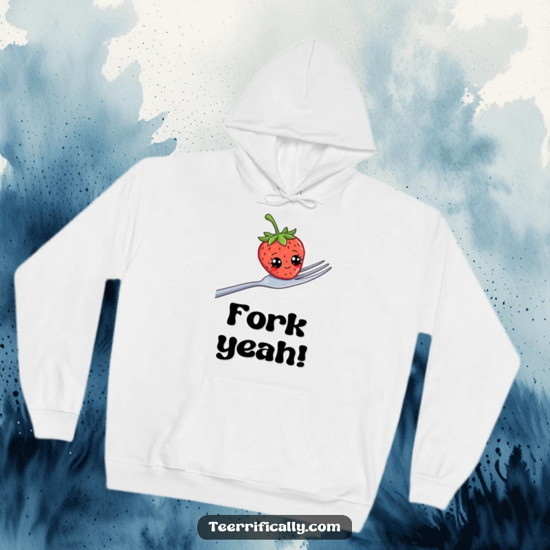 Funny strawberry with silly googly eyes perched on a massive fork, featured on a warm hoodie, bringing smiles.