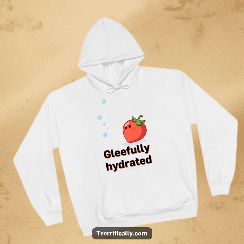 Funny hoodie featuring a happy strawberry juggling tiny sparkling water droplets, celebrating hydration and fun.