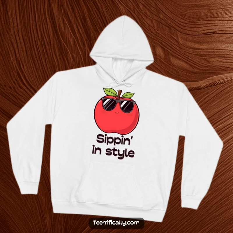 A warm, funny apple hoodie featuring a plump, red apple in sunglasses giving a sly wink, perfect for cozy cool vibes.