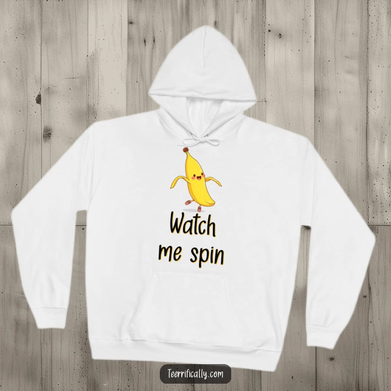 Funny banana peel pirouette hoodie, comfortable apparel featuring a cheerful banana peel in tiny shoes attempting a ballet spin.