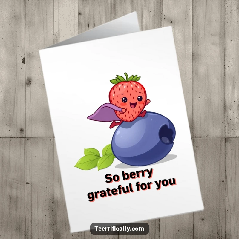 Funny Free Printable Thank You Card: A happy strawberry with a superhero cape leaps over a large blueberry to say thanks.