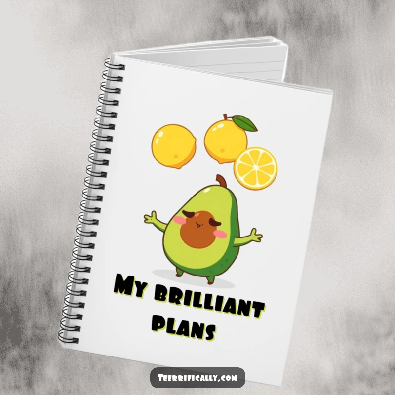 A determined tiny avocado juggles three lemons, featured on a notebook cover for goal-setting and note-taking.