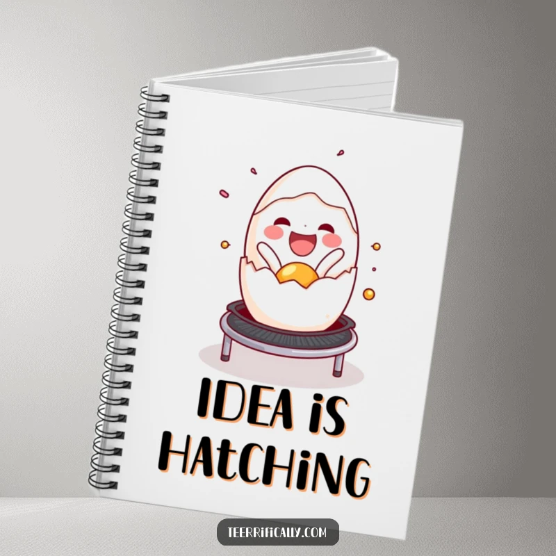 Funny cracked egg notebook cover, joyfully spilling onto a trampoline, inspiring creative ideas and cheerful planning. Useful accessory.