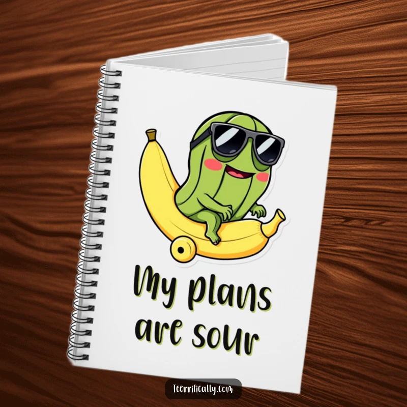 Funny notebook with a cool pickle in sunglasses riding a rolling banana, perfect for jotting notes with absurd, humorous flair.