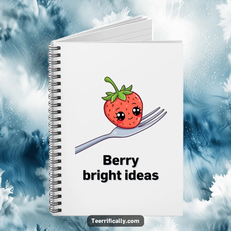 Funny strawberry with comical googly eyes precariously balanced on a giant fork, featured on a notebook cover for jotting ideas.