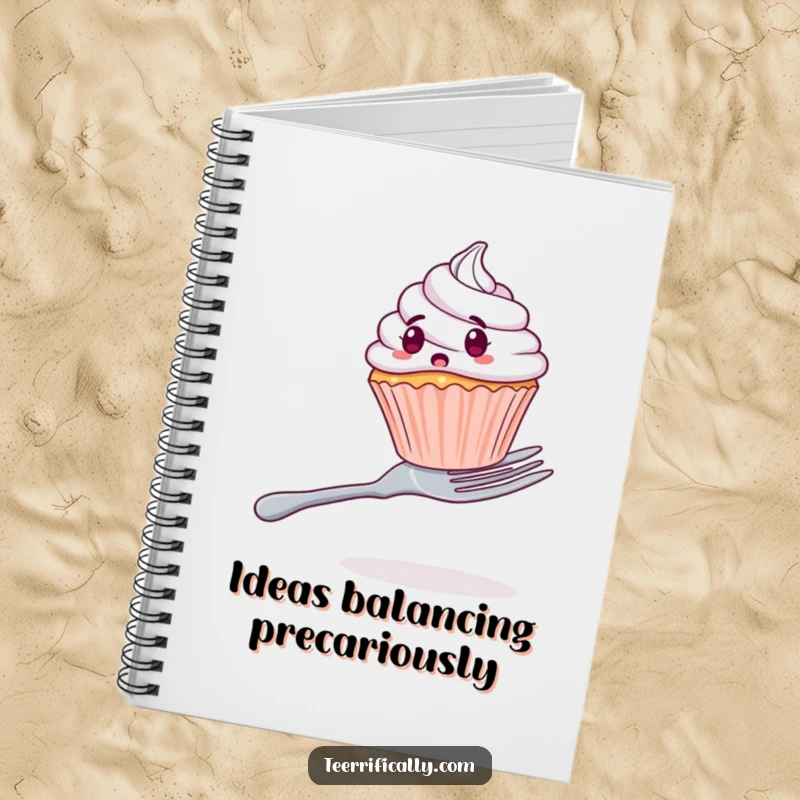 Funny notebook cover showing a startled cupcake attempting to balance on a large fork, great for journaling.