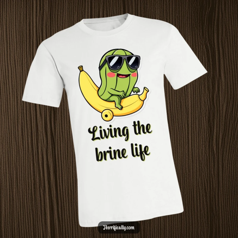 Funny t-shirt with a mischievous pickle in sunglasses riding a rolling banana, exuding cool, absurd, and adventurous vibes.