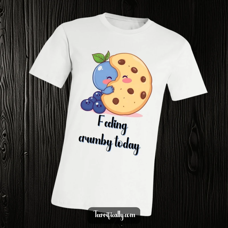 Funny t-shirt depicting a shy blueberry blushing while hiding behind an oversized cookie, conveying adorable timidity.
