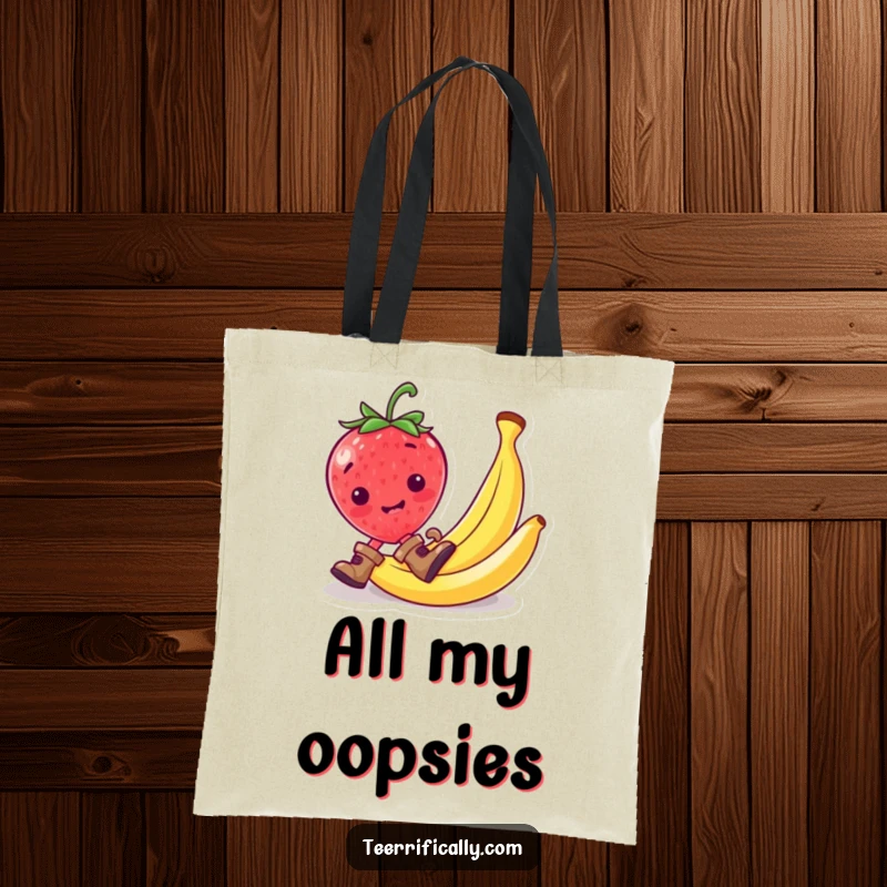Funny strawberry wearing tiny boots, slipping on a banana peel, printed on a funny tote bag.