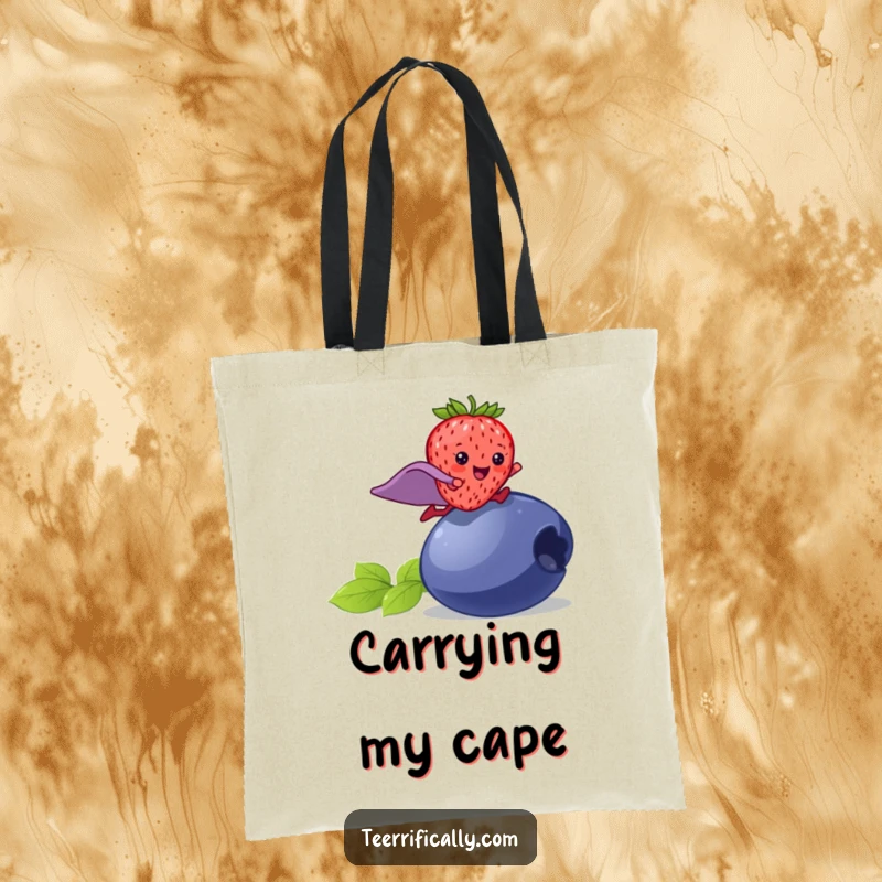 Funny strawberry superhero tote bag, a happy strawberry in a cape leaping over a blueberry, practical and humorous accessory.