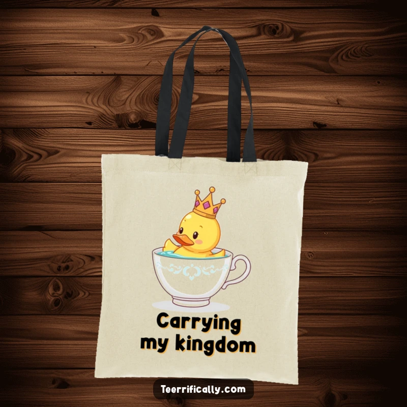 Funny rubber duck wearing a tiny crown floating in a teacup, durable tote bag for a funny gift.