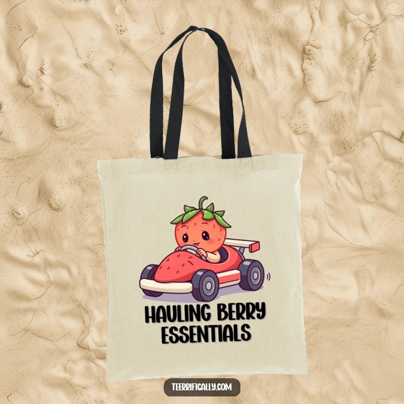 Funny tote bag showcasing a determined strawberry piloting a miniature race car made of a berry, ready for a comical journey.