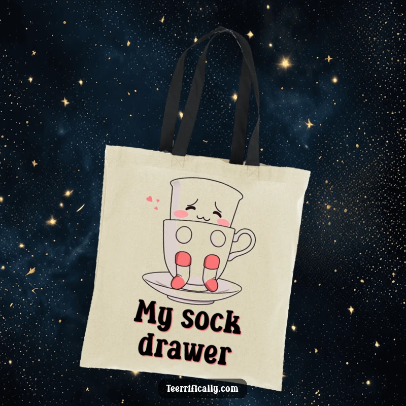 Funny tote bag displaying a confused teacup in socks attempting to float, ideal for carrying quirky essentials.